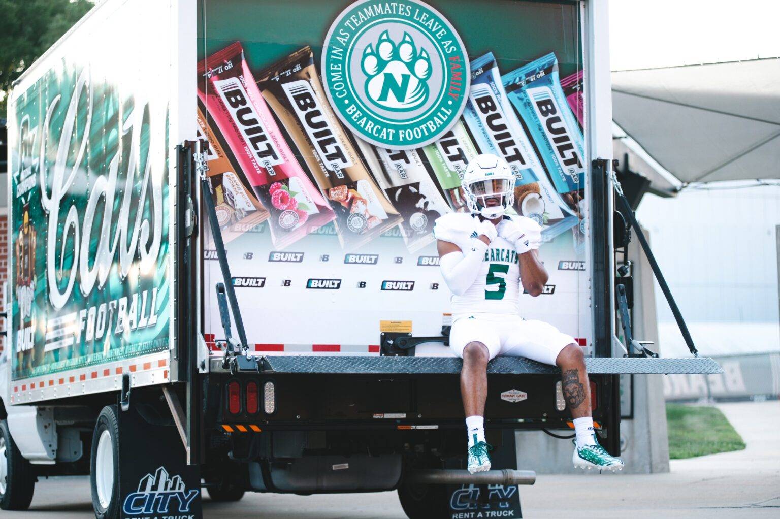 A box truck rental with a custom wrap, showcasing branding and versatility from City Rent a Truck.