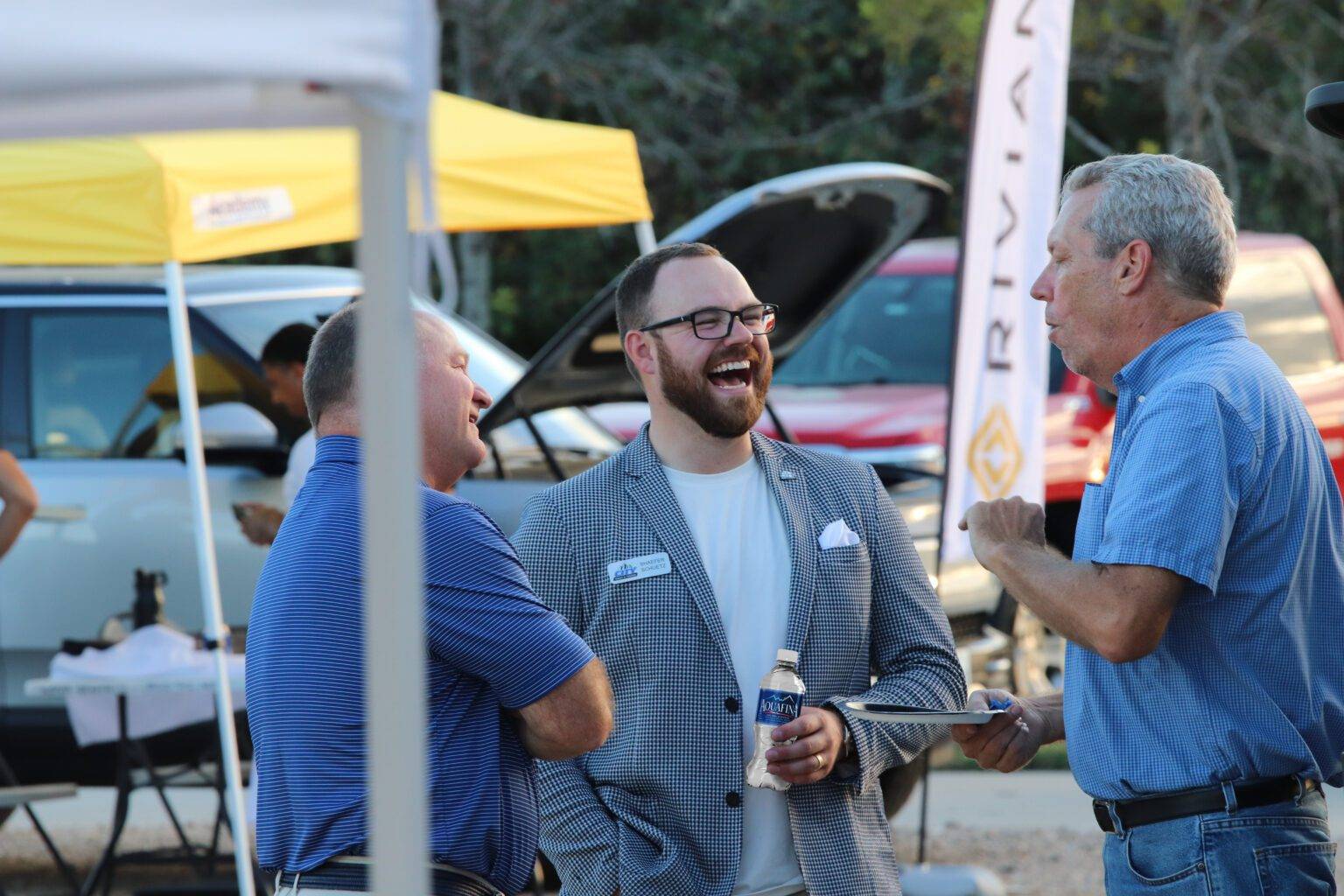 City Rent a Truck employees talking with a customer, sharing a laugh while providing personalized and friendly service.